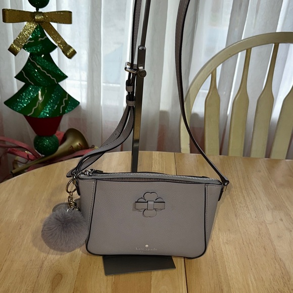 kate spade Handbags - Kate Spade Light Gray Crossbody Bag with Pom Pom